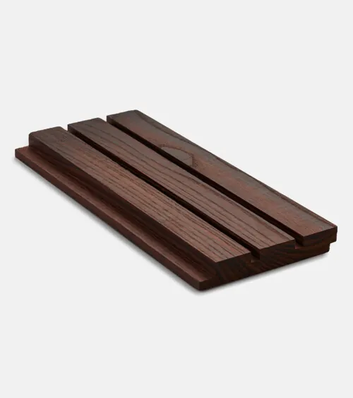 Dark walnut acoustic wood slat wall panel sample photographed at angle on gray background, studio product photography
