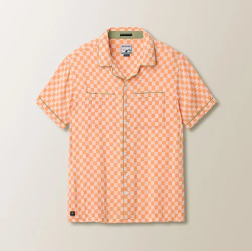 Flat lay photography of an orange checkered short-sleeve button-down shirt for e-commerce apparel photography.