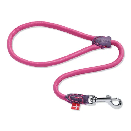 Pink rolled leather dog leash with silver clip photographed on white background, pet product photography