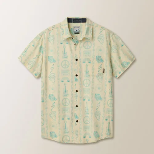 Flat lay photography of a short-sleeve tropical print button-down shirt for apparel e-commerce photography.