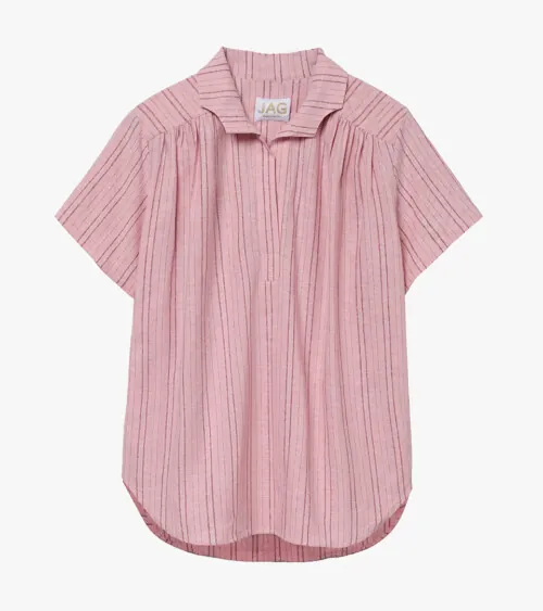 Flat lay photography of a pink textured women's blouse for fashion e-commerce photography.
