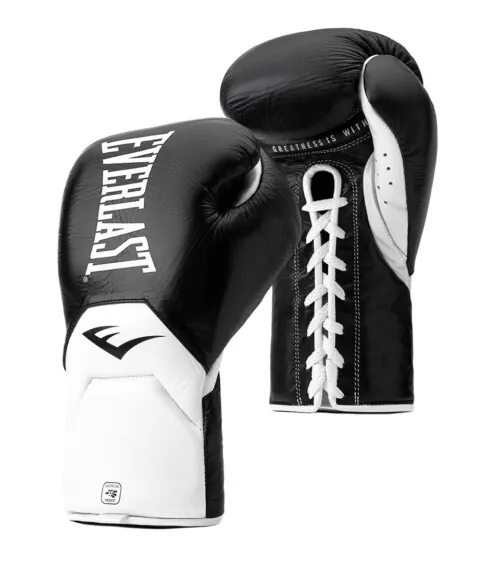 Pair of black and white leather boxing gloves standing upright on white background, studio product photography