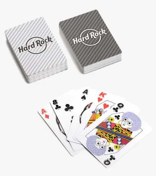 Two decks of playing cards with a fanned poker hand on white background, studio product photography