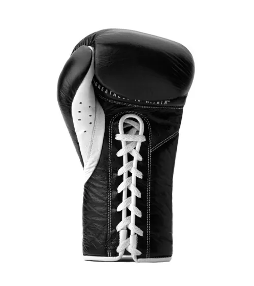 Single black lace-up leather boxing glove photographed on white background, studio product photography