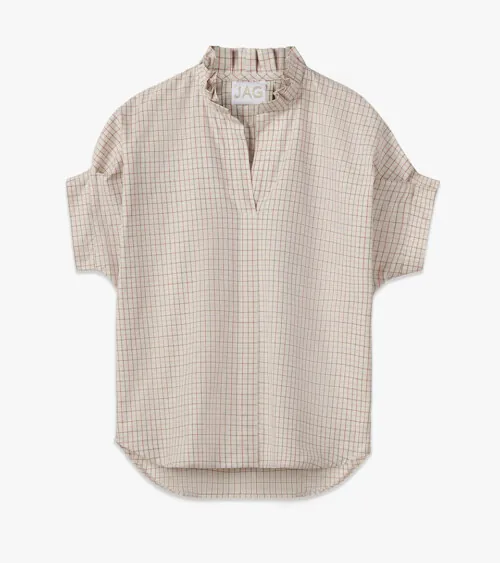 Flat lay photography of a beige check-pattern women's blouse for online retail clothing photography.
