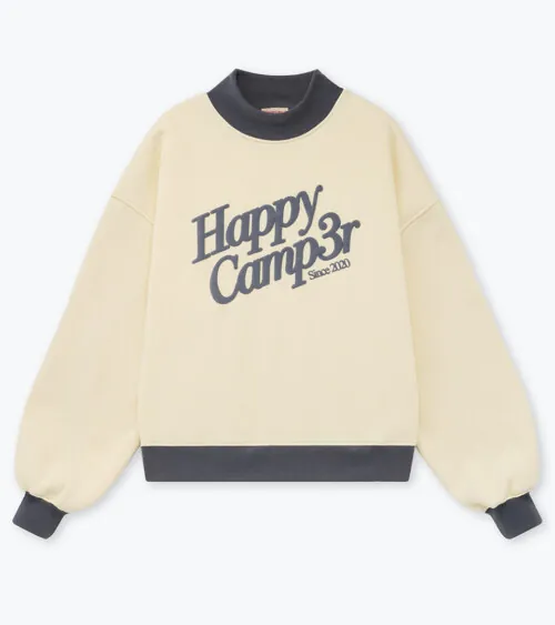 Flat lay photography of a cream graphic sweatshirt with charcoal contrast trim