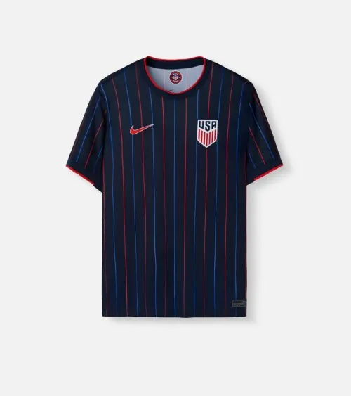 Flat lay photography of a navy striped soccer jersey for e-commerce clothing photography by Shootify.