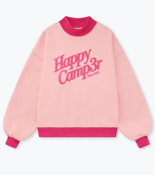 Flat lay photography of a pink graphic sweatshirt with contrast ribbed trim