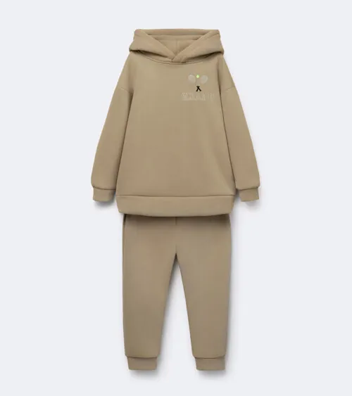Flat lay photography of a beige children's hoodie and jogger set photographed for e-commerce clothing photography.