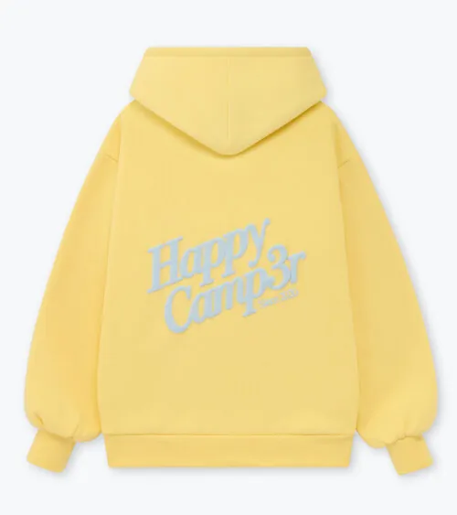Flat lay photography showing the back view of a yellow graphic hoodie photographed for apparel e-commerce.