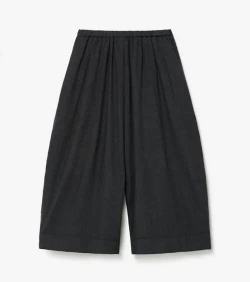 Flat lay photography of black wide-leg pants photographed for e-commerce apparel photography.