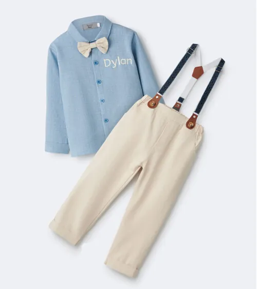 Flat lay photography of a formal children's outfit with suspenders, dress shirt, and trousers for online retail clothing photography.