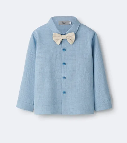 Flat lay photography of a light blue children's dress shirt with bow tie for e-commerce apparel photography.