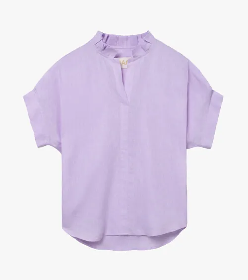 Flat lay photography of a lavender women's blouse for e-commerce apparel photography.