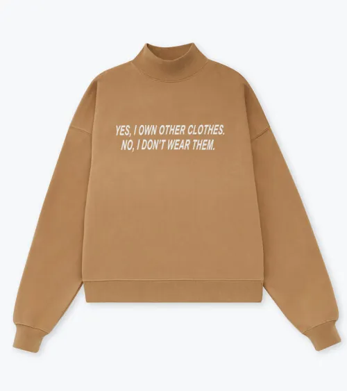Flat lay photography of a tan oversized sweatshirt photographed for apparel e-commerce photography.