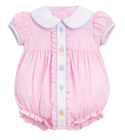 flat lay photography of a pink gingham baby romper with Peter Pan collar